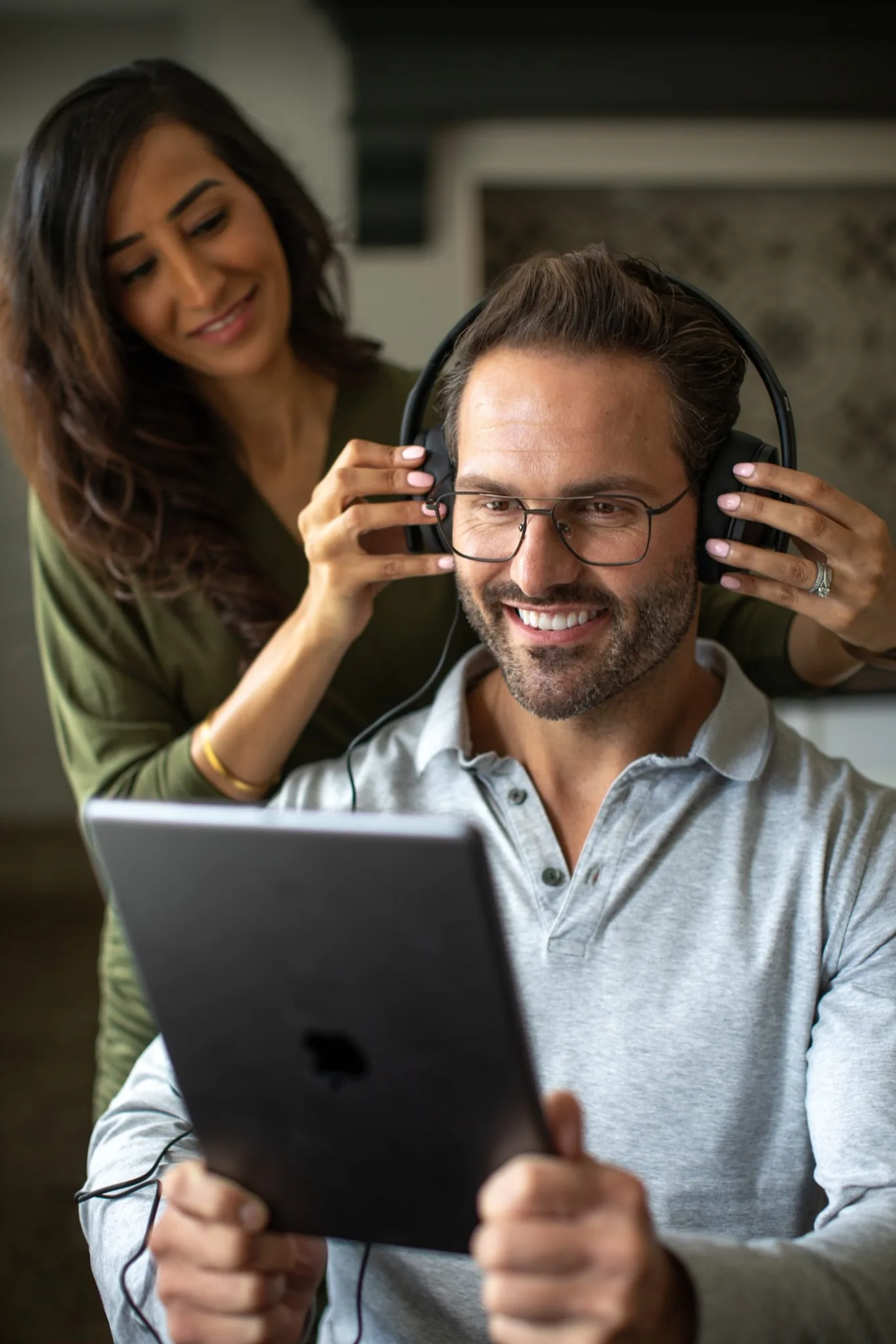 Audiologist carrying out an adult hearing assessment